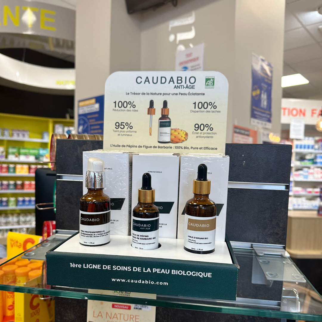 Flacon d'huile de pépins de figue de barbarie pure et bio, élégamment posé sur une étagère de pharmacie, prêt à être acheté par des clients cherchant où se procurer ce produit naturel pour leurs soins anti-âge.