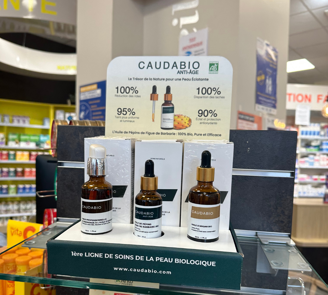 Flacon d'huile de pépins de figue de barbarie pure et bio, élégamment posé sur une étagère de pharmacie, prêt à être acheté par des clients cherchant où se procurer ce produit naturel pour leurs soins anti-âge.